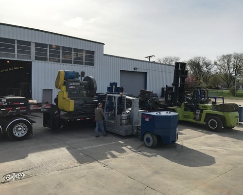 Loading a 106,000 LB lathe